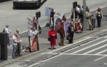 Jason Storms, Michael Marcavage, and others exhalt the Lord in song (left) as doctors and abortionists cross the street outside of the Moscone Center in San Francisco.