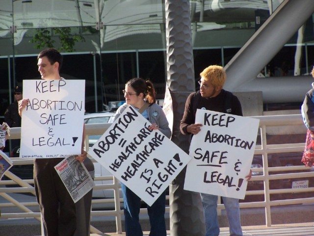 Abortionist cheerleaders gather outside of the convention.