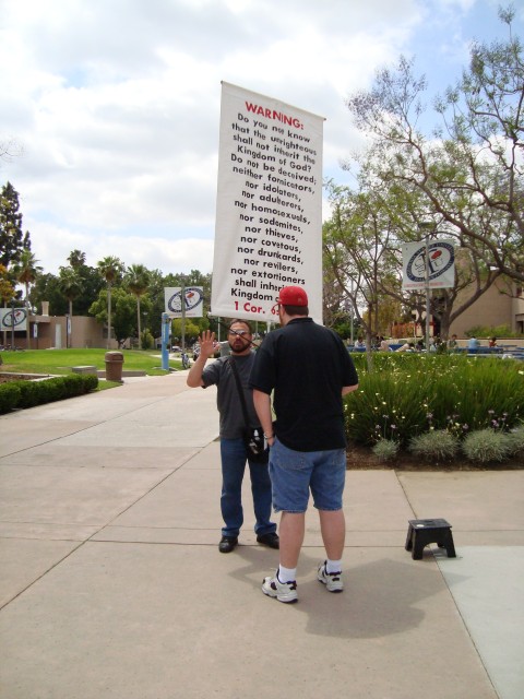 Jim Deferio being confronted by an atheist. -California State University at Fullerton 