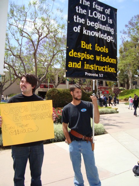 Another student takes a turn with the sign. -California State University at Fullerton. 