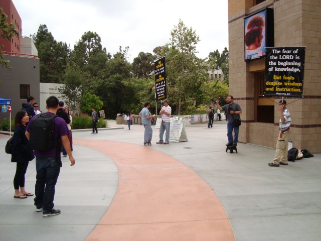 Jim Deferio preaches to students as the pass by. -University of California at Irvine