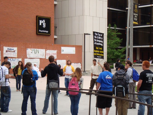 Ben "Sheepdog" Bloedorn (in the white and yellow shirt) preaches to a growing crowd of students at California State University Long Beach.