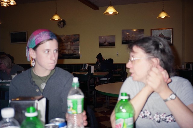 Faith (right) speaks to a young woman who we invited to lunch about Christ.