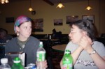 Faith (right) speaks to a young woman who we invited to lunch about Christ.