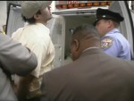 Michael Marcavage about to be placed in patty wagon.