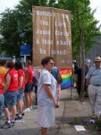 Nancy Major holding a Gospel banner.