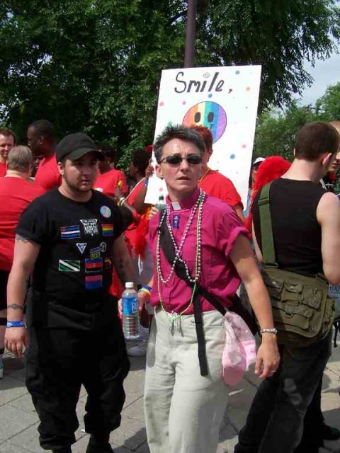 Homosexual "pastor" rips up Gospel tracts when distributed.