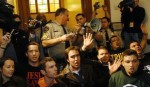 Repent America kneels in front of clerk's office singing "I've decided to follow Jesus" to prevent distribution of illegal marriage licenses.