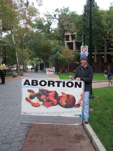 DAY 1 - Talitha holds sign on UPENN's campus