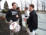 Mark Diener and Tim Gruber share the Gospel with different atheists outside the Hyatt Regency hotel. (Mark left front, Tim right back)