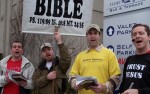 Repent America sings hymns outside of the Hyatt Regency hotel at the National Convention of American Atheists. (L to R - Mark Gruber, Howie Mclasky, Michael Marcavage, and Mark Diener)