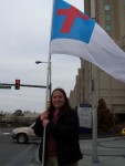 Susan Startzell holds the Christian flag.