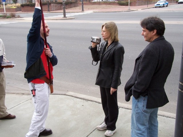 Aaron Sullivan speaks to atheists on camera.