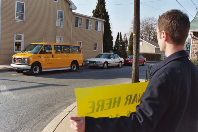 Nathan showing sign at intersection