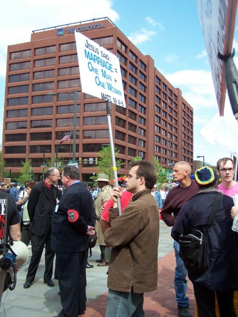 Chris Deferio holding sign.