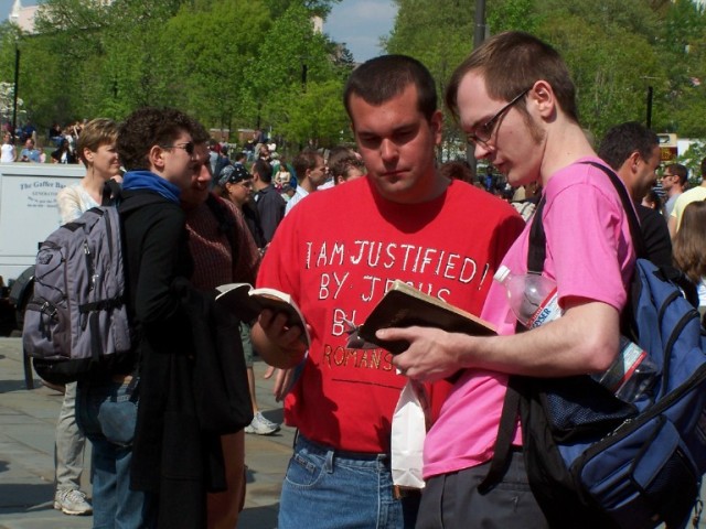 Tim Gruber (left) witnesses to a homosexual man at the event.
