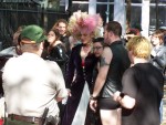 A man dressed like a woman parades near the histroic Christ Church.