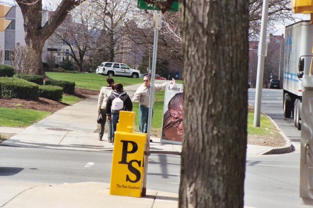 Randy distributing literature on sidewalk